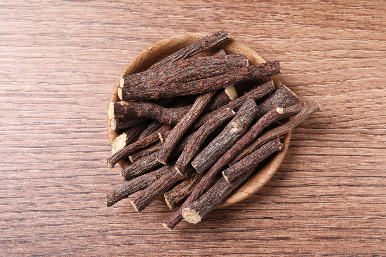 Dried Sticks of Liquorice Root on Wooden Table, Top View